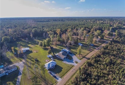Aerial view over sunny village of Dry Prong, LA